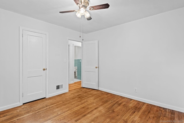 unfurnished bedroom with baseboards, light wood-style flooring, and ceiling fan