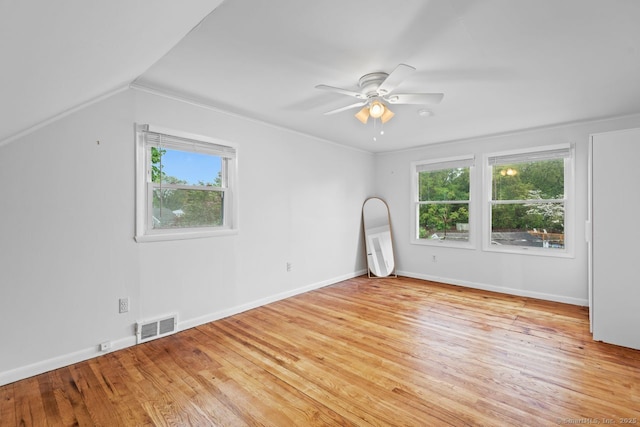 bonus room featuring ceiling fan, light wood finished floors, and baseboards