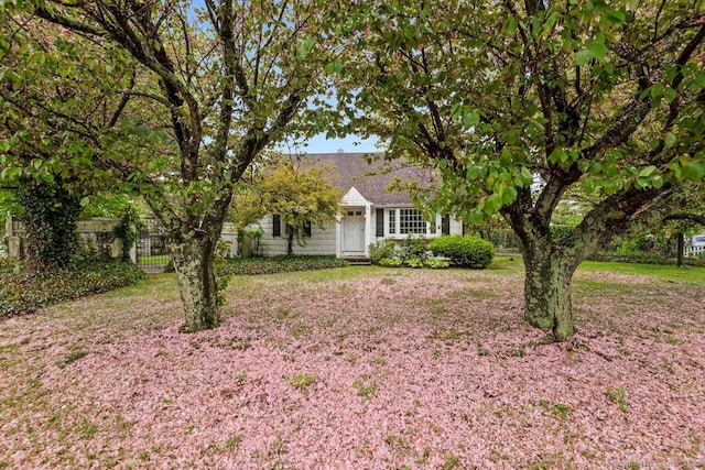view of front of house featuring fence