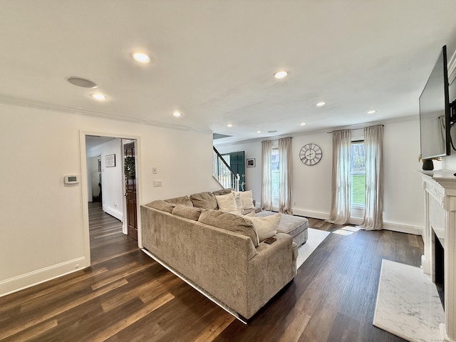 33 Steep Hill Rd, Seymour, CT 06483 - living room with stairs, a premium fireplace, ornamental molding, recessed lighting, and dark wood-style flooring