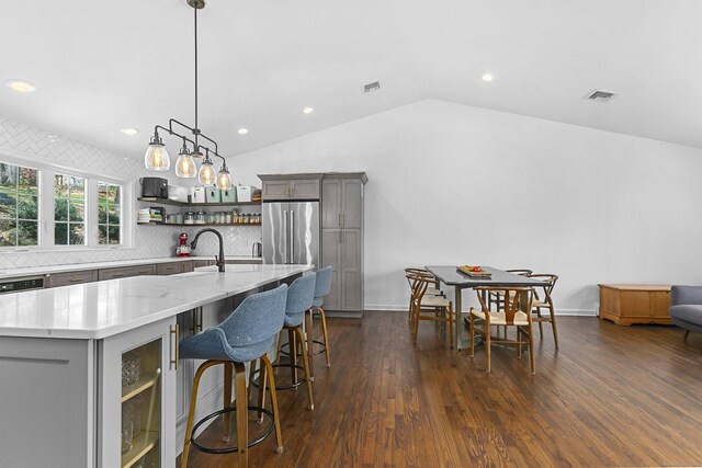 95 Brighton View Rd, Fairfield, CT 06824 - kitchen featuring gray cabinetry, high quality fridge, open shelves, lofted ceiling, and tasteful backsplash