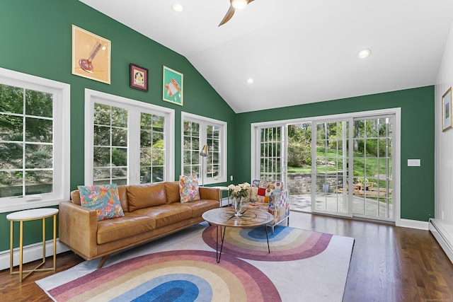 living area featuring a ceiling fan, a baseboard heating unit, wood finished floors, and lofted ceiling
