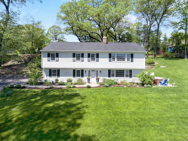 95 Brighton View Rd, Fairfield, CT 06824 - view of front facade featuring a chimney and a front lawn