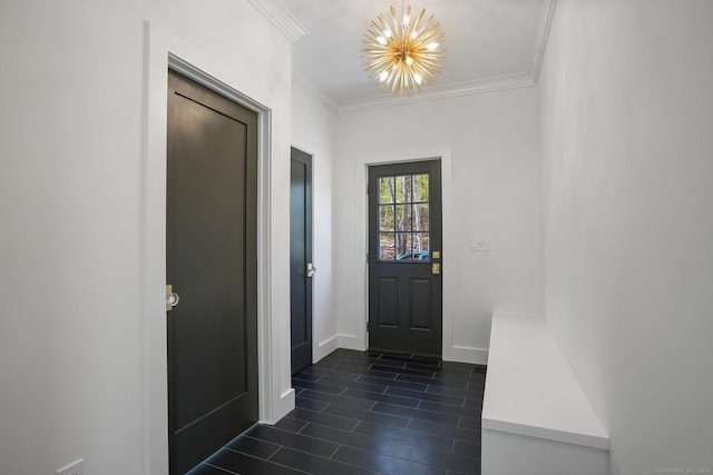 interior space featuring dark tile patterned flooring, baseboards, an inviting chandelier, and ornamental molding