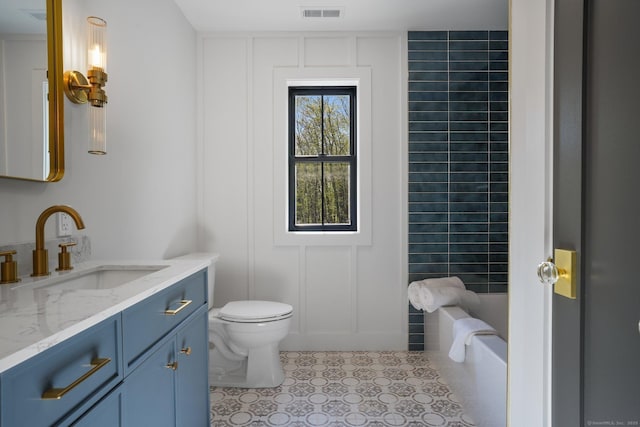 bathroom featuring visible vents, vanity, toilet, walk in shower, and a bath