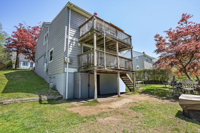 back of house with a wooden deck, stairs, a yard, and a balcony