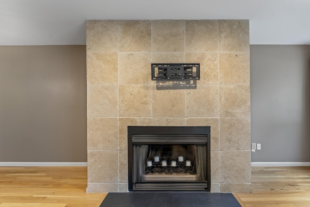 12 Boulevard Dr Unit 21-130, Danbury, CT 06810 - detailed view of wood finished floors, baseboards, and a fireplace