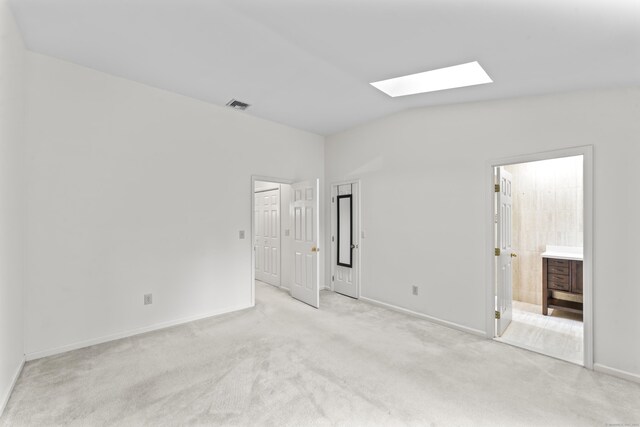12 Boulevard Dr Unit 21-130, Danbury, CT 06810 - unfurnished bedroom with a skylight, lofted ceiling, light carpet, and ensuite bathroom
