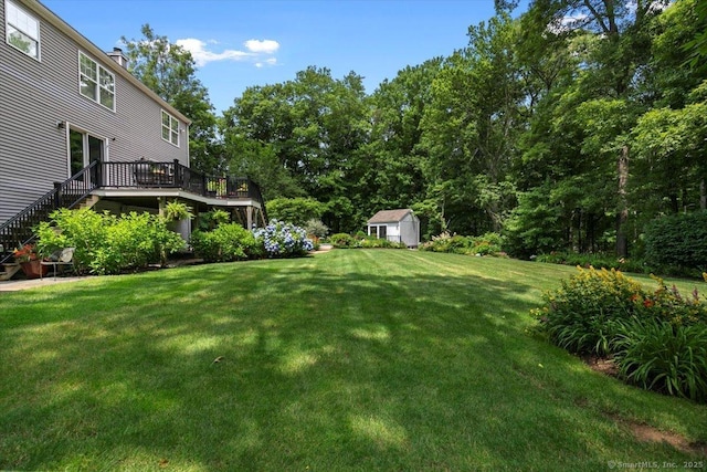 5 Pheasant Run, Guilford, CT 06437 - view of green lawn with a wooden deck, a shed, and stairs