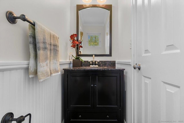 5 Pheasant Run, Guilford, CT 06437 - bathroom featuring ornamental molding, vanity, a wainscoted wall, and a decorative wall