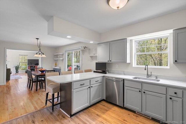 5 Pheasant Run, Guilford, CT 06437 - kitchen with gray cabinets, stainless steel dishwasher, a peninsula, a breakfast bar, and recessed lighting