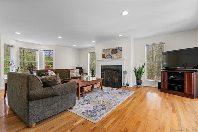 5 Pheasant Run, Guilford, CT 06437 - living area featuring light wood-type flooring, a fireplace with flush hearth, and recessed lighting