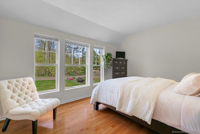 5 Pheasant Run, Guilford, CT 06437 - bedroom with multiple windows, light wood-style flooring, and vaulted ceiling