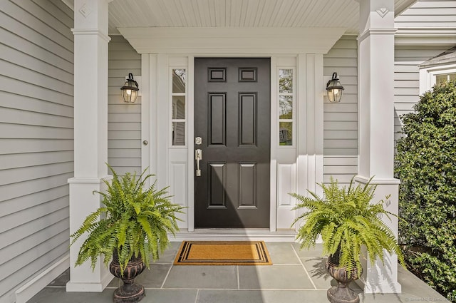 doorway to property with covered porch
