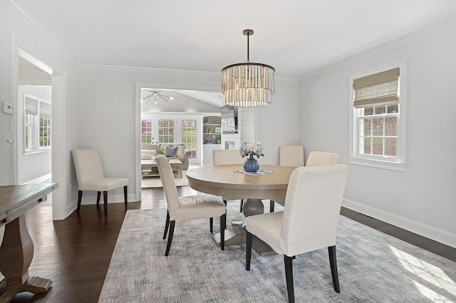 dining area with baseboards, plenty of natural light, and dark wood-style floors