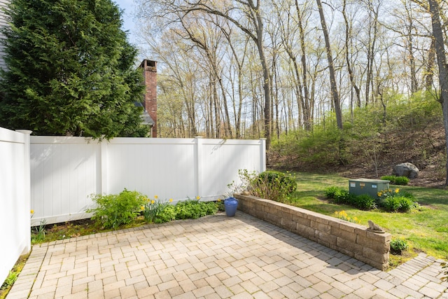 view of patio featuring fence