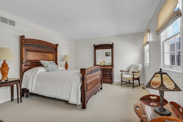 bedroom featuring carpet floors, baseboards, and visible vents
