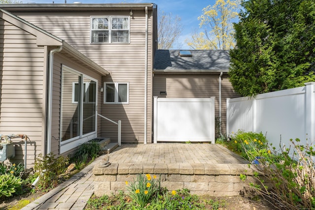 back of house with a patio area and fence