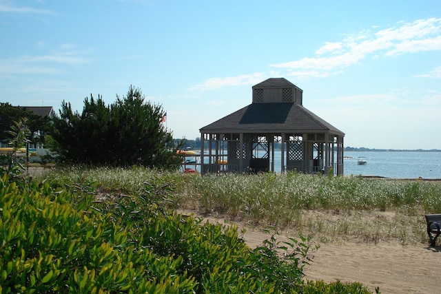 surrounding community featuring a water view