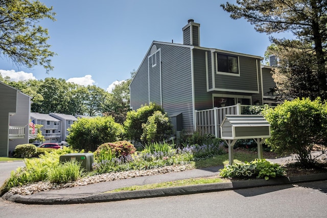 17 Ives Hill Ct Unit 17, Cheshire, CT 06410 - view of property exterior with a chimney