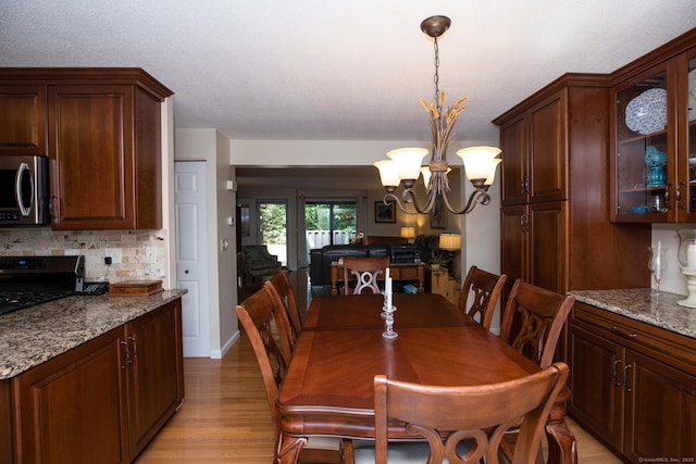 17 Ives Hill Ct Unit 17, Cheshire, CT 06410 - dining space with light wood-style floors and a chandelier