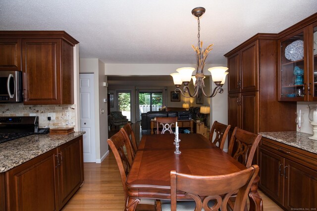17 Ives Hill Ct Unit 17, Cheshire, CT 06410 - dining area featuring light wood-style flooring and a chandelier