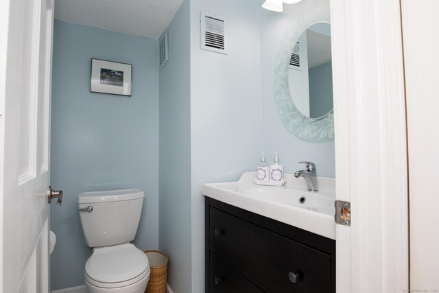 17 Ives Hill Ct Unit 17, Cheshire, CT 06410 - half bathroom featuring vanity, toilet, and baseboards