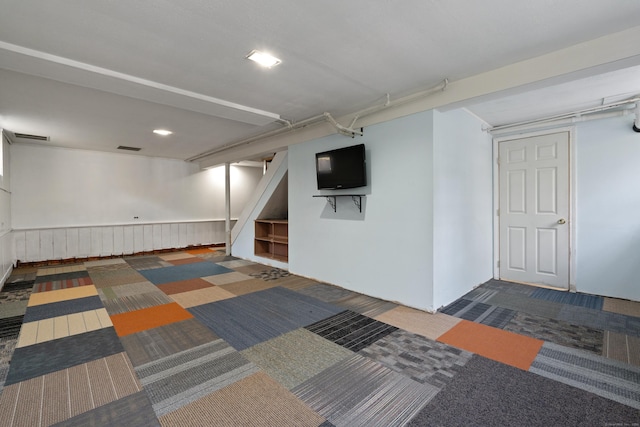 finished below grade area with carpet and stairway