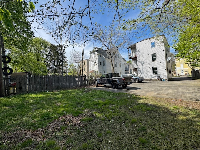 view of yard with fence and a residential view