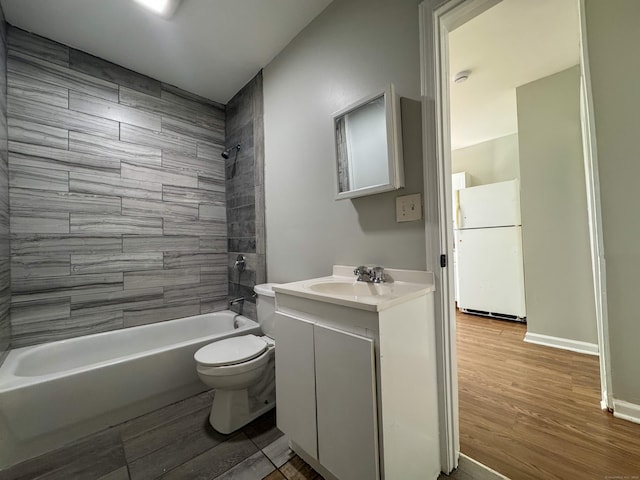 bathroom with vanity, shower / bathing tub combination, toilet, and wood finished floors