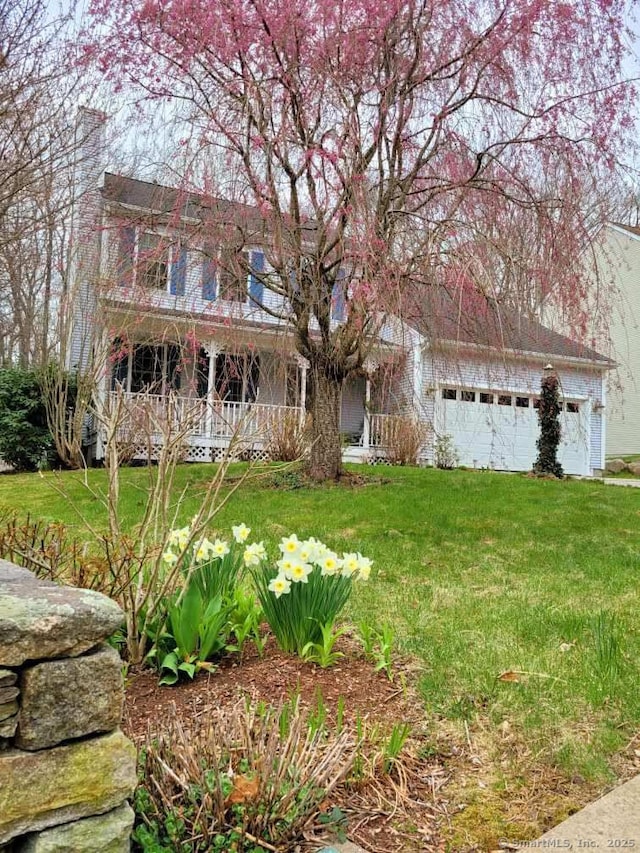 view of front of property with a porch and a front yard