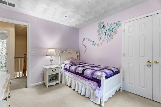 bedroom with light carpet, baseboards, and visible vents