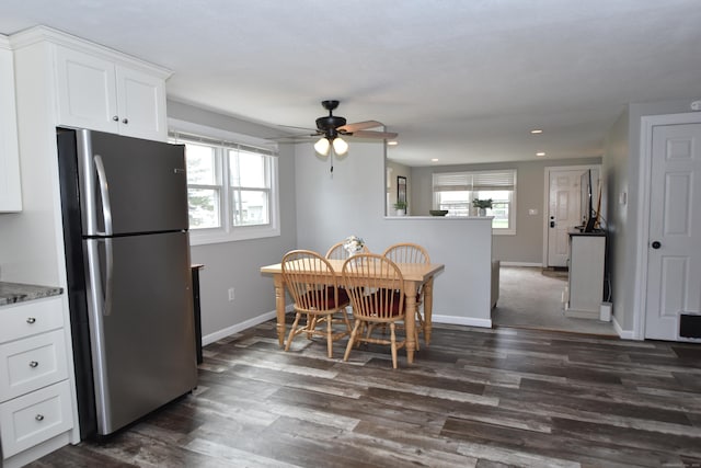dining space with a ceiling fan, baseboards, recessed lighting, and dark wood-type flooring