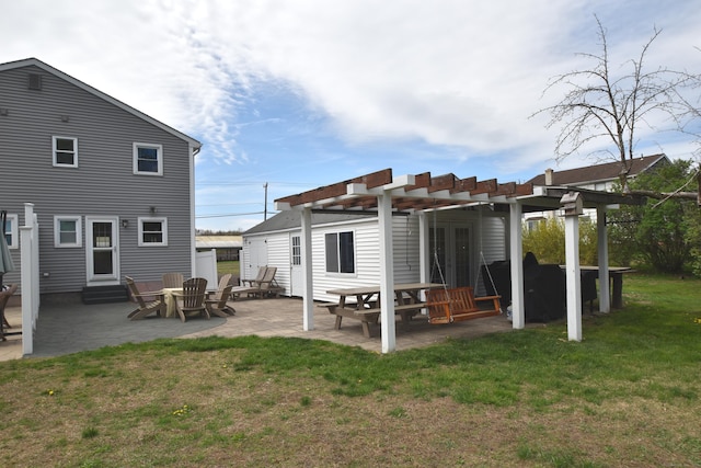 back of house featuring a lawn, a pergola, a patio, and entry steps