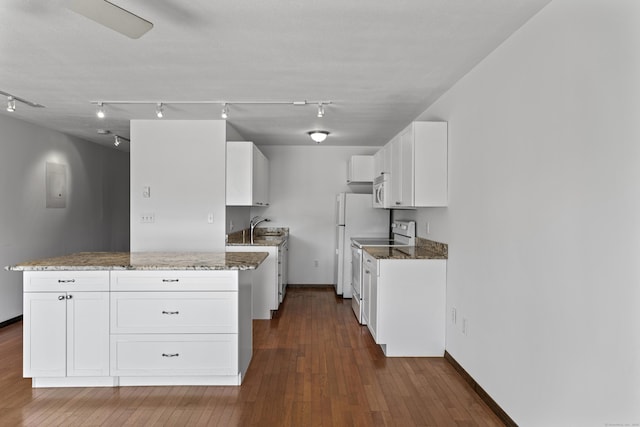 241 W Walk Unit 241, West Haven, CT 06516 - kitchen featuring rail lighting, stone countertops, white appliances, and white cabinets