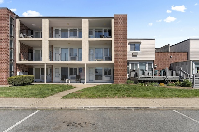 241 W Walk Unit 241, West Haven, CT 06516 - view of property featuring uncovered parking
