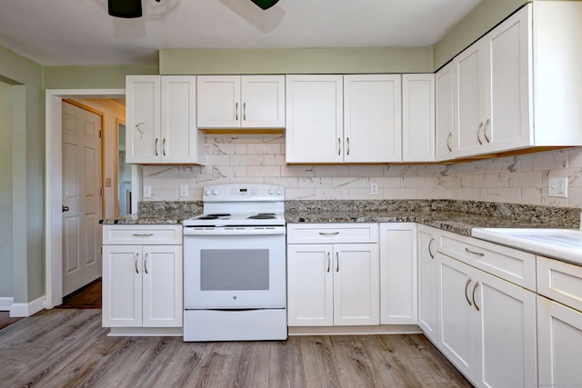 kitchen featuring light stone counters, light wood-style flooring, white cabinetry, decorative backsplash, and white range with electric cooktop