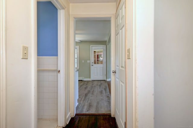 corridor featuring dark wood finished floors