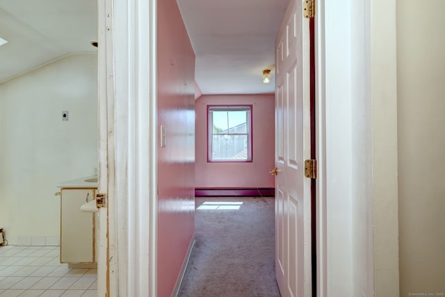 corridor with light carpet, lofted ceiling, and baseboard heating