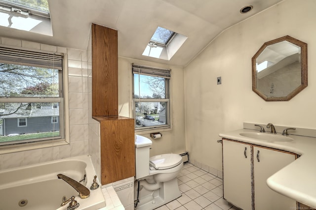 full bathroom featuring a wealth of natural light, lofted ceiling with skylight, a tub with jets, and tile patterned flooring