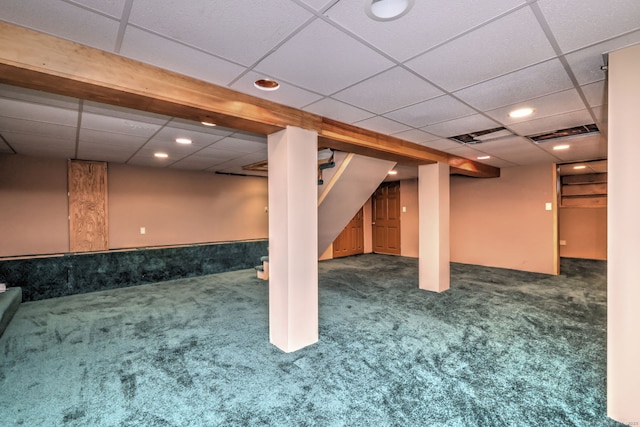 finished basement with a paneled ceiling, carpet flooring, and recessed lighting