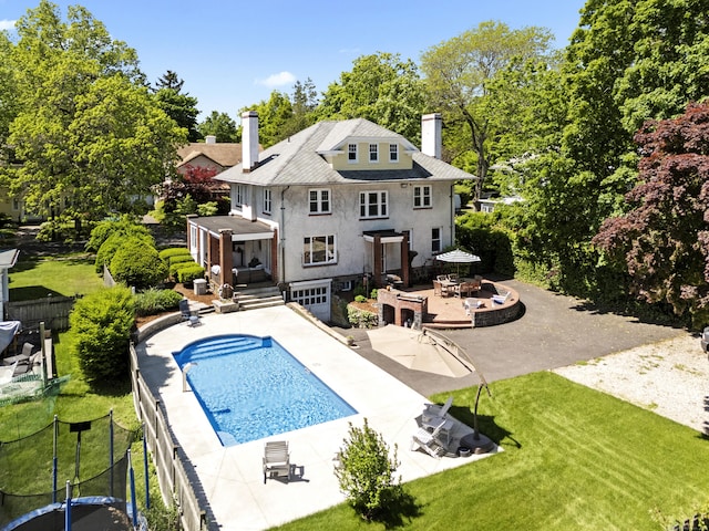 173 Westwood Rd, New Haven, CT 06515 - back of house featuring a chimney, outdoor dining area, a deck, a patio area, and stucco siding