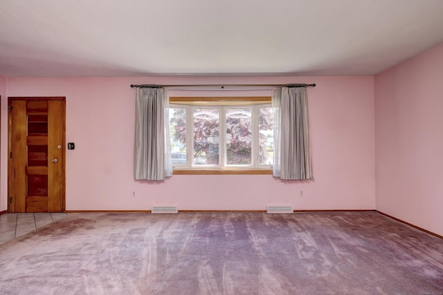 145 Russell Rd, Stratford, CT 06614 - carpeted empty room with baseboards