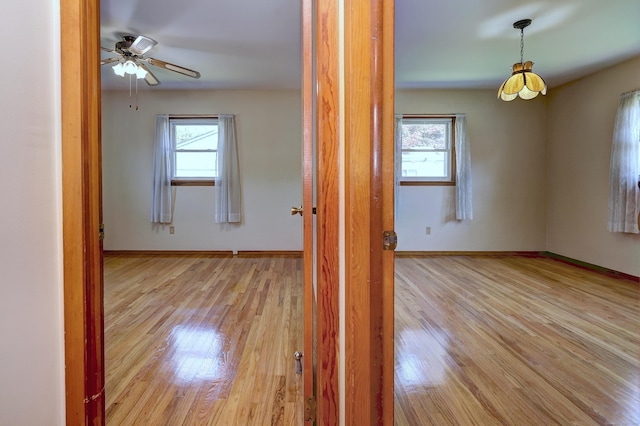 145 Russell Rd, Stratford, CT 06614 - spare room featuring wood finished floors, baseboards, and ceiling fan