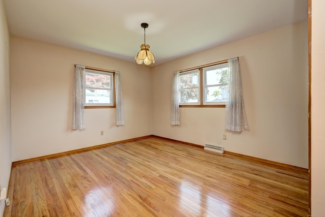 145 Russell Rd, Stratford, CT 06614 - empty room with light wood-type flooring and baseboards