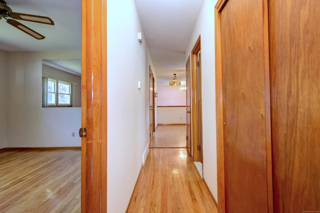 145 Russell Rd, Stratford, CT 06614 - hall featuring light wood-style floors and baseboards