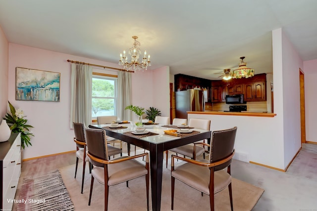 145 Russell Rd, Stratford, CT 06614 - dining space with a chandelier, baseboards, and ceiling fan