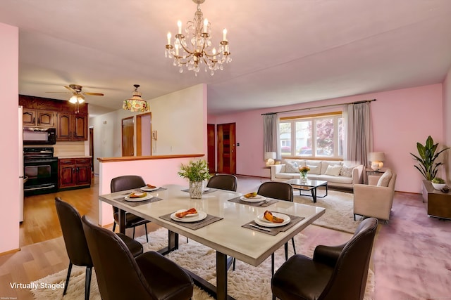 145 Russell Rd, Stratford, CT 06614 - dining room with a chandelier, ceiling fan, and light wood finished floors