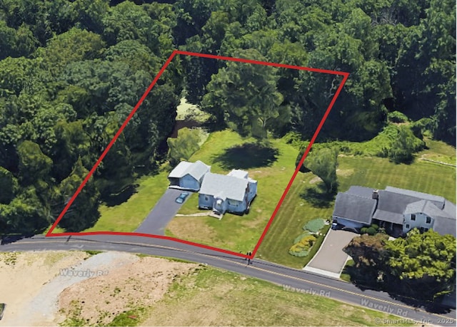 aerial view featuring a wooded view