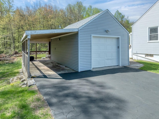 garage with a garage and driveway